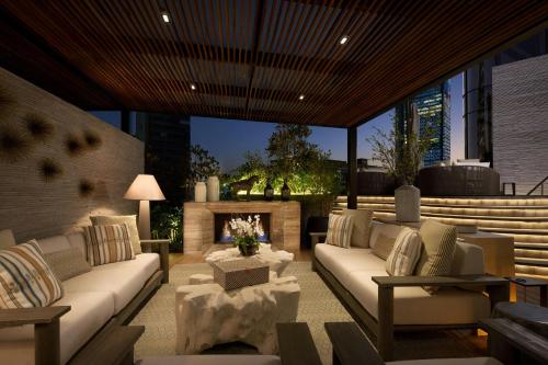 a living room with a couch and a fireplace at The St. Regis Mexico City in Mexico City