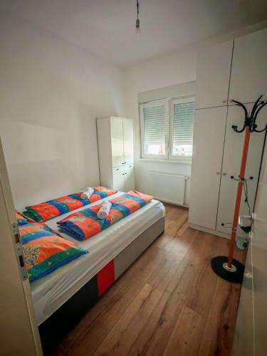 a bedroom with a bed in a room at Apartman 1 - Pejak in Banja Koviljača