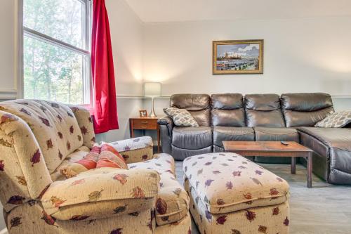 a living room with two couches and a couch at 1 Mi to Pisgah Natl Forest Wooded Haven with Deck in Pisgah Forest