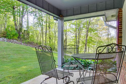 a screened in porch with a table and chairs at 1 Mi to Pisgah Natl Forest Wooded Haven with Deck in Pisgah Forest