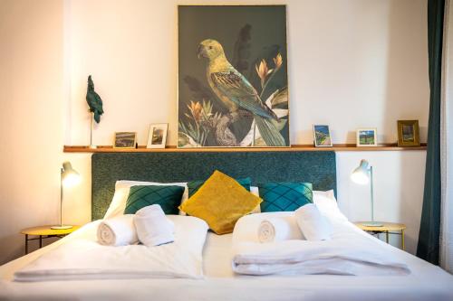 a bedroom with a bed with two pillows at Reihenvilla Ambachgasse in Caldaro