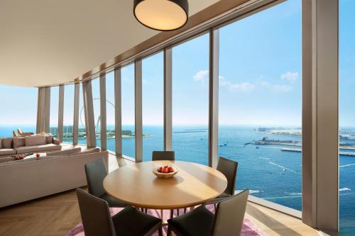 a dining room with a view of the ocean at Rixos Premium Dubai JBR in Dubai