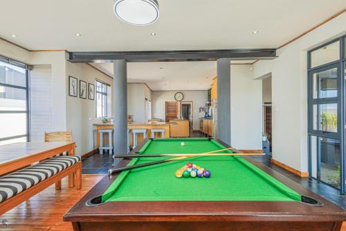 a pool table in a living room with a pool table at 41 on Park Langebaan in Langebaan