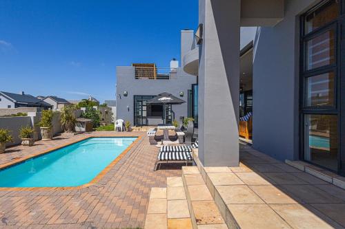 a house with a swimming pool in a yard at 41 on Park Langebaan in Langebaan