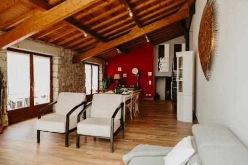 a living room with white chairs and a table at Casa do Sorrio - Slow Down, Live Now in Viana do Castelo