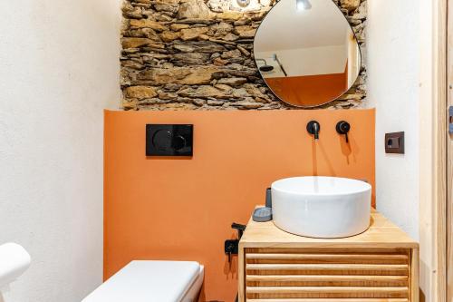 a bathroom with a sink and a mirror at Casa Sarvaega in Cogorno