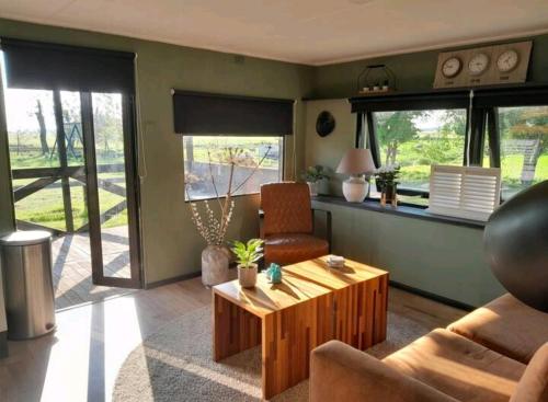 a living room with a couch and a coffee table at No Milk today in Scherpenzeel