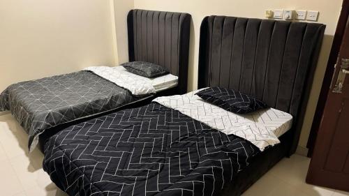 Postel nebo postele na pokoji v ubytování Hammed Apartment Seeb