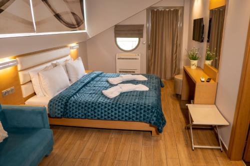 Postel nebo postele na pokoji v ubytování Hotel Epavlis Eleftheriadi
