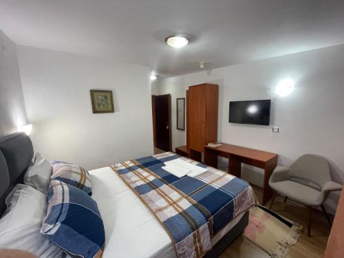 Postel nebo postele na pokoji v ubytování Hotel Square