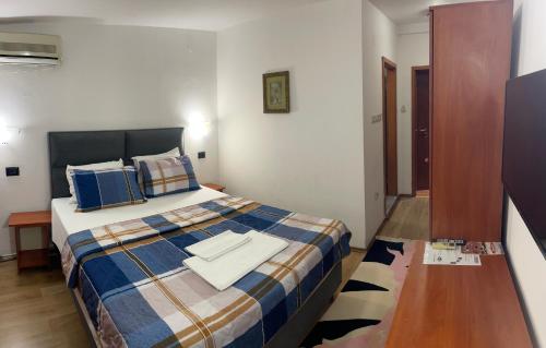 Postel nebo postele na pokoji v ubytování Hotel Square