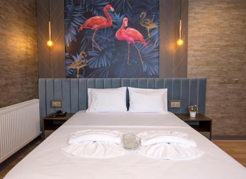 a bedroom with a bed with two towels on it at La Vie Suite Hotel in Istanbul