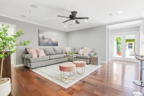 a living room with a couch and a table at Walk to Ventura Boulevard Pool & HotTub with PingPong & BBQ in Sherman Oaks