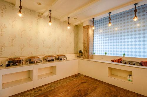 a room with a counter and a window withools at W Hotel Shamshabad Hyderabad Airport Zone in Hyderabad