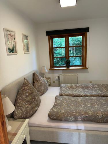 a bedroom with two beds and a window at Fördefarm-Natura in Westerholz