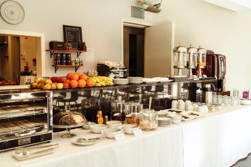 a kitchen with a bunch of food on a counter at Albergue de Santa Luzia - Peregrinos de Santiago in Viana do Castelo