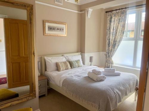 a bedroom with a bed with a teddy bear on it at Luxury 1 Bedroom Apartment in Southend w Parking in Southend-on-Sea