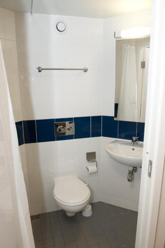 a bathroom with a toilet and a sink at University of Essex - Southend Campus in Southend-on-Sea