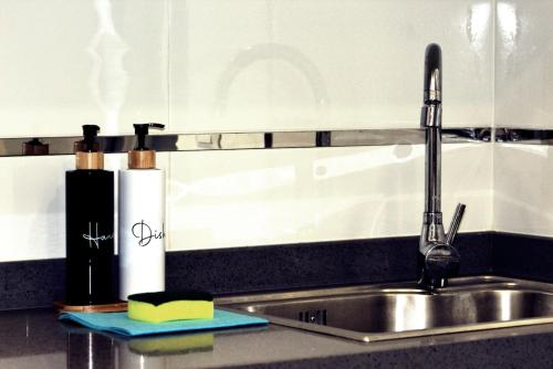 a kitchen sink with a faucet and a sink at Villa Ocean 8 by Dreaming Lanzarote Villas in Yaiza