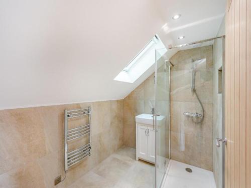 a bathroom with a shower and a sink at Foxton Barn in Harrietsham