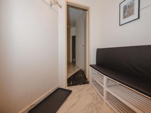 a living room with a television and a hallway at Apartment Villa Hiss by Interhome in Bad Gastein