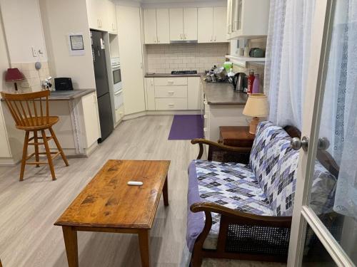 a living room with a couch and a table at 76 Companion Crescent in Higgins