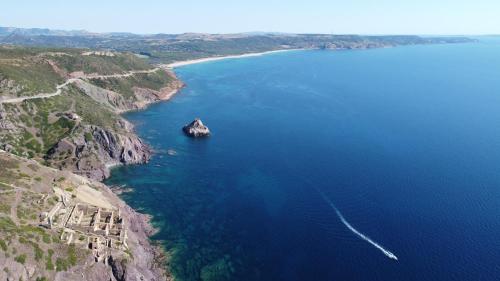 an island in the middle of a large body of water at Villa Laura in Nebida
