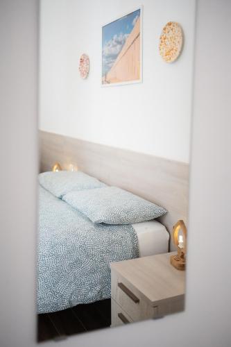 Postel nebo postele na pokoji v ubytování Nonna Vittoria Apartments