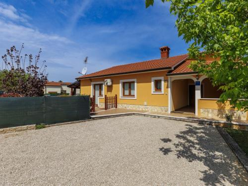 a house with a driveway in front of it at Holiday Home Soriso by Interhome in Motovun