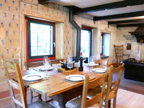 a wooden table in a room with a dining room at Holiday Home Casa Jolli by Interhome in Semione