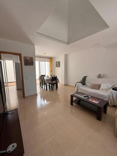 a living room with a couch and a table at Vera Rambla in Vera