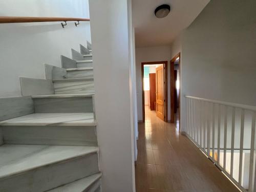 a staircase in a house with a hallway at Vera Rambla in Vera