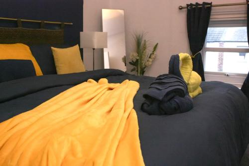 a bedroom with a bed with a stuffed animal on it at Coastal Comfort in Hartlepool