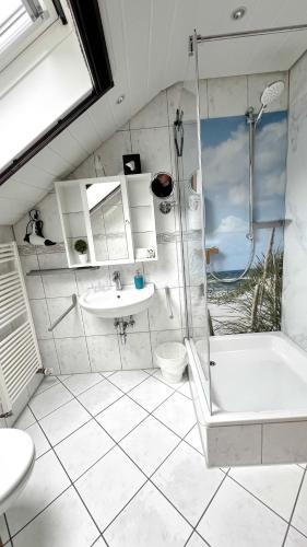 a bathroom with a shower and a sink and a tub at Hotel zur Loreley - Garni in Sankt Goar