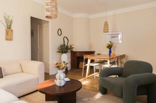 a living room with a couch and a table at Appartement Unique! Au centre historique with 2 bedrooms and terrace in Collioure