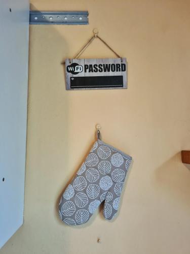 a towel hanging on a wall with a sign at IL Posticino DI Bellagio in Civenna