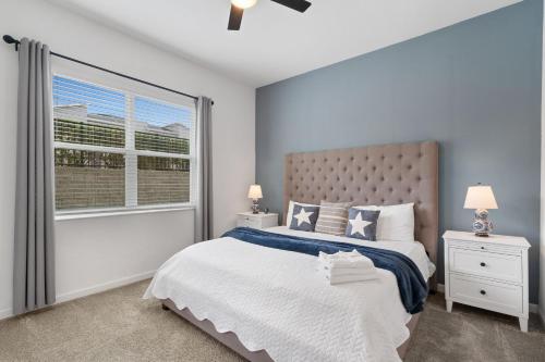 a bedroom with a large bed and a window at CONDO 2bed2bath next to Disney w Free Water Park in Kissimmee