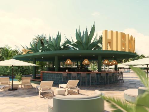a resort with chairs and a bar with a h sign at Bahia Principe Grand Tequila - Adults Only All Inclusive - New Opening Dec 2025 in Akumal