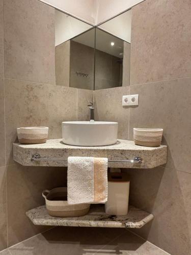 a bathroom with a sink and a mirror at Haus Johannes in Wagrain