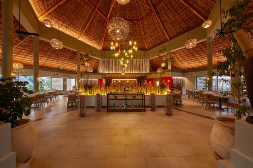 a large restaurant with tables and chairs and chandeliers at Bahia Principe Grand Tequila - Adults Only All Inclusive - New Opening Dec 2025 in Akumal
