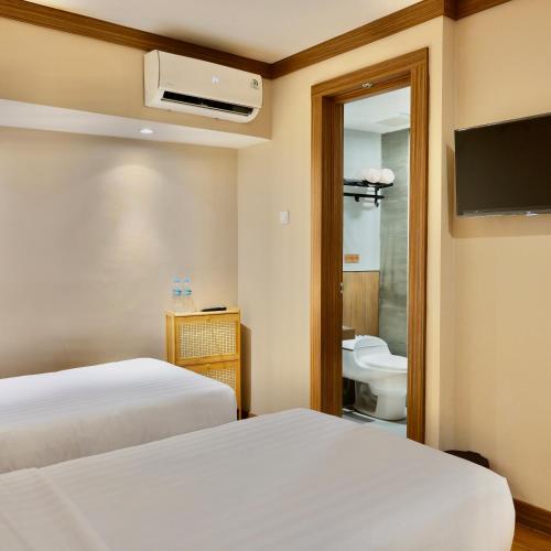 Letto o letti in una camera di The Ryokan Semarang