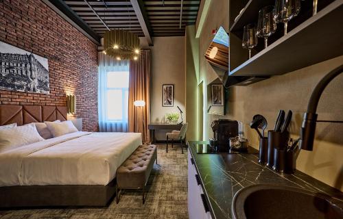 a hotel room with a bed and a sink at CITYHOTEL Residence in Kyiv