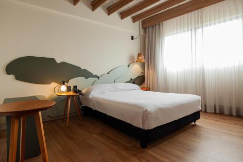 Una cama o camas en una habitación de Ibis Styles Maragogi - O primeiro Ibis Styles pé na areia do Brasil
