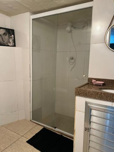 a shower with a glass door in a bathroom at Bandeira do Brasil in Rio de Janeiro