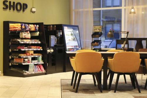 a store with a table and chairs in a store at Scandic Kirkenes in Kirkenes