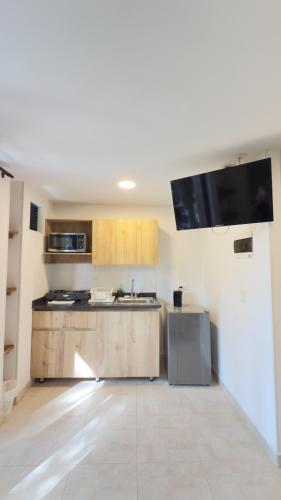a kitchen with a sink and a counter top at Edificio Fenicia Lofts Laureles in Medellín