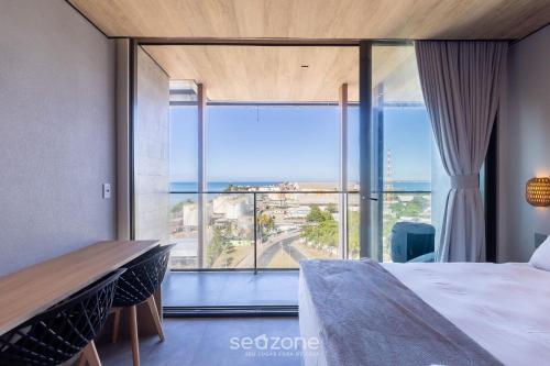 Una cama o camas en una habitación de NWTs - Estudios con vista lateral al mar en Maceió III