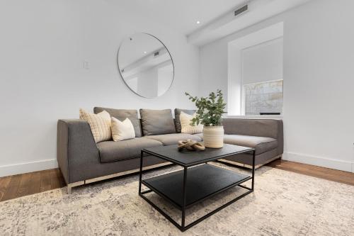a living room with a couch and a table at The SFX Old Port in Montréal