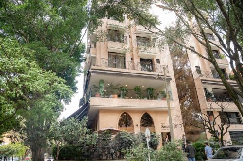 a building with a balcony on the side of it at Edificio Fenicia Lofts Laureles in Medellín