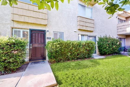 a building with a brown door in a yard at 2 Bed 2 Bath Vacation home in Scottsdale in Scottsdale